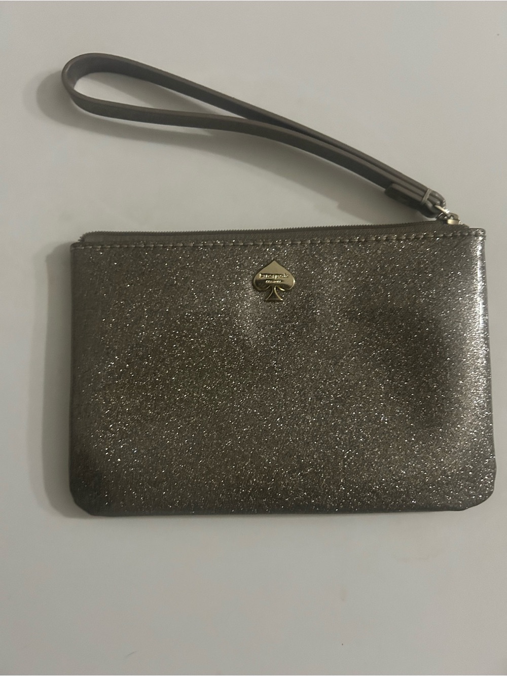 kate spade Silver Glitter Wristlet Clutch with Strap with Gold logo